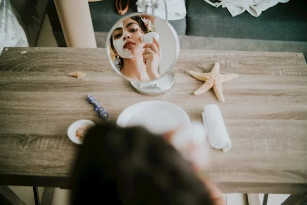 A relaxing self-care Sunday ideas setup with skincare products, candles, and a checklist for Self-Care Sunday Ideas.
